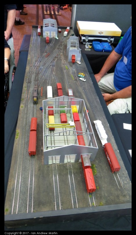 Image 6: An overview of the layout from the 3-road shed. Note the travelling crane over two of the roads and a full concrete floor.